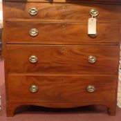 A 19th century mahogany and elm chest fitted four long graduated drawers with brass oval plate