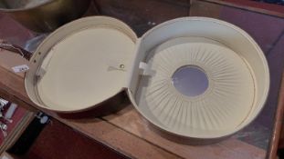 A retro faux snakeskin ladies vanity case of cylindrical form.