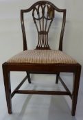 A set of six George III hepplewhite design mahogany dining chairs, the hoop backs with pierced splat
