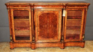 A 19th Century early Victorian burr walnut amboyna and marquetry inlaid breakfronted credenza, the