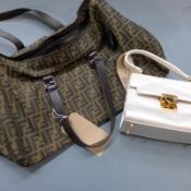 A vintage designer Fendi white satin evening bag along with a large Fendi shopper bag with padlock