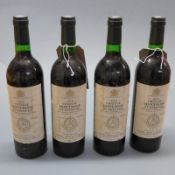 A set of four bottles of Chateau Montrose St. Estephe 1976 red wine (4)