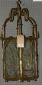 A late 19th Century Aesthetic Period brass hall lantern, the original glass panels engraved with