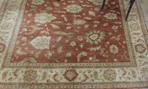 A large ziegler design carpet, the all over palmette design on an abrashed terracotta ground
