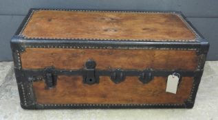 An early 20th Century stained wood and studded metal clad steamer trunk, 46cm x 110cm x 55cm