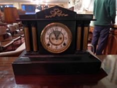 A late 19th Century American ebonised mantel clock by The Ansonia Clock Co., New York. having gilt