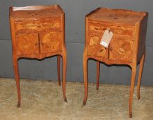 A pair of French kingwood and marquetry inlaid tables de nuits, the single drawer over cupboard