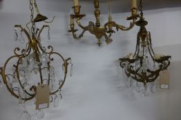A set of three similar 19th Century design brass chandeliers, two having cut glass droplets (3)
