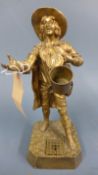 A 19th Century Italian gilt bronze figure of a street vendor with inkwell in the base, H.45cm