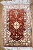 A fine handmade pure silk wall hanging, probably Hereke, the foliate and palmette design on a