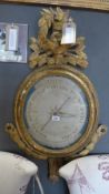 A 19th Century French giltwood barometer, by Selon Corvelly, having bird nest crest 87cm x 54cm