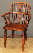 A 19th Century country elm Windsor open armchair, the spindled back over shaped seat raised on