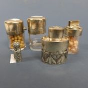A silver tea cannister collection of four silver pill bottles and miniature silver perfume bottle