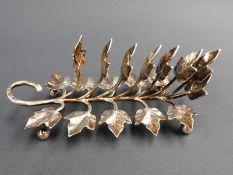 A Victorian silver toast rack, by Walter and John Bernard, 1889, having vine leaf decoration
