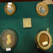 A Regency wax miniature portrait in an ebonised and glazed gilt frame, three other gilt frame