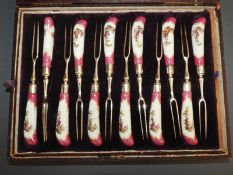 A Meissen porcelain cutlery set of 12 forks and 12 knives. Two pronged forks and curved bladed