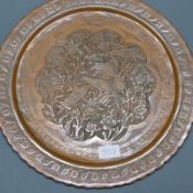 An antique Persian Isfahan signed and decorated metal charger, D.38cm, together with an antique