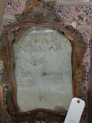 An early 18th Century wall mirror, the shaped original plate within hand painted Chinoiserie