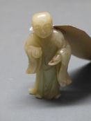 A Chinese Qing dynasty celadon jade figure of a deity H.10cm