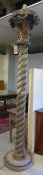 A pair of large Continental pine architectural columns, having carved capitals over barley twist