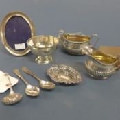A Victorian silver jug and bowl, silver bowl, flatware, silver bon bon dish and silver easel photo