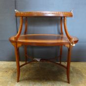 An Edwardian inlaid satinwood etagere of two crossbanded oval tiers with lift off tray on slender