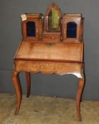 A late Victorian inlaid walnut bonheur du jour, the superstructure with central mirror flanked by