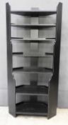 A contemporary Oka ebonised corner shelving unit of six drawers, 200cm x 38