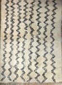A genuine Moroccan Berber (Beni Ourain) the all over zig zag design on an ivory ground 145cm x