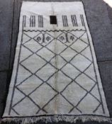 A vintage Moroccan Marmoucha rug, the all geometric temple design on an ivory ground within brown