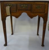 A George III country made oak lowboy, the moulded top above three drawers on pad feet supports, 81cm