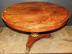 An early 19th Century Regency rosewood and brass inlaid breakfast table, the figures round top