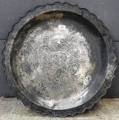 An Islamic white metal charger, D.64cm