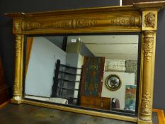 An early 19th Century Regency giltwood overmantel mirror, the rectangular plate within ebonised