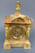 A fine quality 19th Century onyx mantle clock, flanked with caryatid