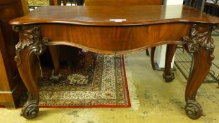 A 19th Century mahogany serving table, the serpentine concertina top over typical Gillows style