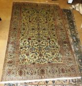 An extremely fine central Persian kashan carpet 320cm x 220cm, with floral vines and palmettes