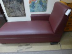 A contemporary designer daybed of angular form, the burgandy leather upholstery over block