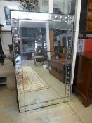 A contemporary Venetian design wall mirror, the antique style rectangular bevelled plate within