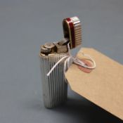 A vintage Cartier lighter, stamped, H.7cm