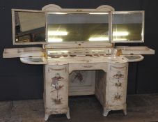 An early 20th Century custom made mahogany kidney formed dressing desk/chest in a hand painted