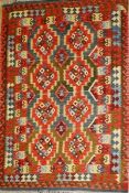 A large Anatolian kilim rug, the all over geometric design on a turquoise ground within