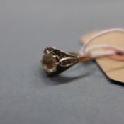 An Art Deco period diamond ring, the central stone with inclusions