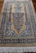 An antique silk wall hanging probably hereke, the tree of life design on a golden ground within