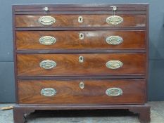 A George III mahogany bachelors chest, the rectangular caddy top above brushing slide and four