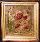 An early 20th Century Oklad icon mother and child, gilt overlay, original mahogany case 34cm x 29cm