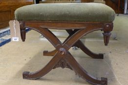 A 19th Century early Victorian Gothic Revival rosewood footstool, the green plush upholstery over