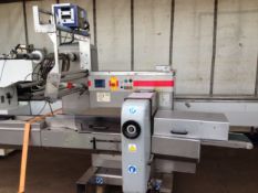 2002 Record Scorpion flow wrap machine. Ice hs coder. Serial No: 09-02-154