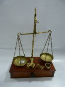 Set of Brass Pharmaceutical Scales on Mahogany Stand