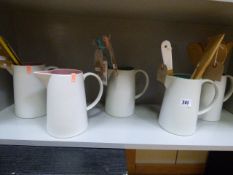 *5 Jugs containing Wood Utensils